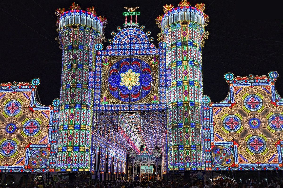 Elaborate luminarie facade glowing at night in Scorrano, Salento